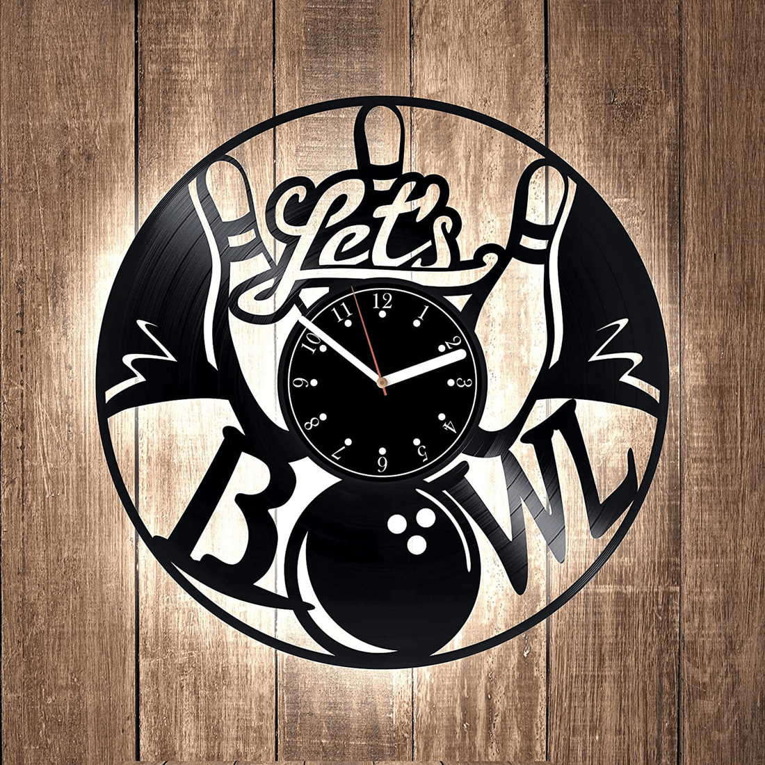 Bowling-themed wall clock with a "Let's Bowl" design on a vinyl record, featuring bowling pins and a ball.