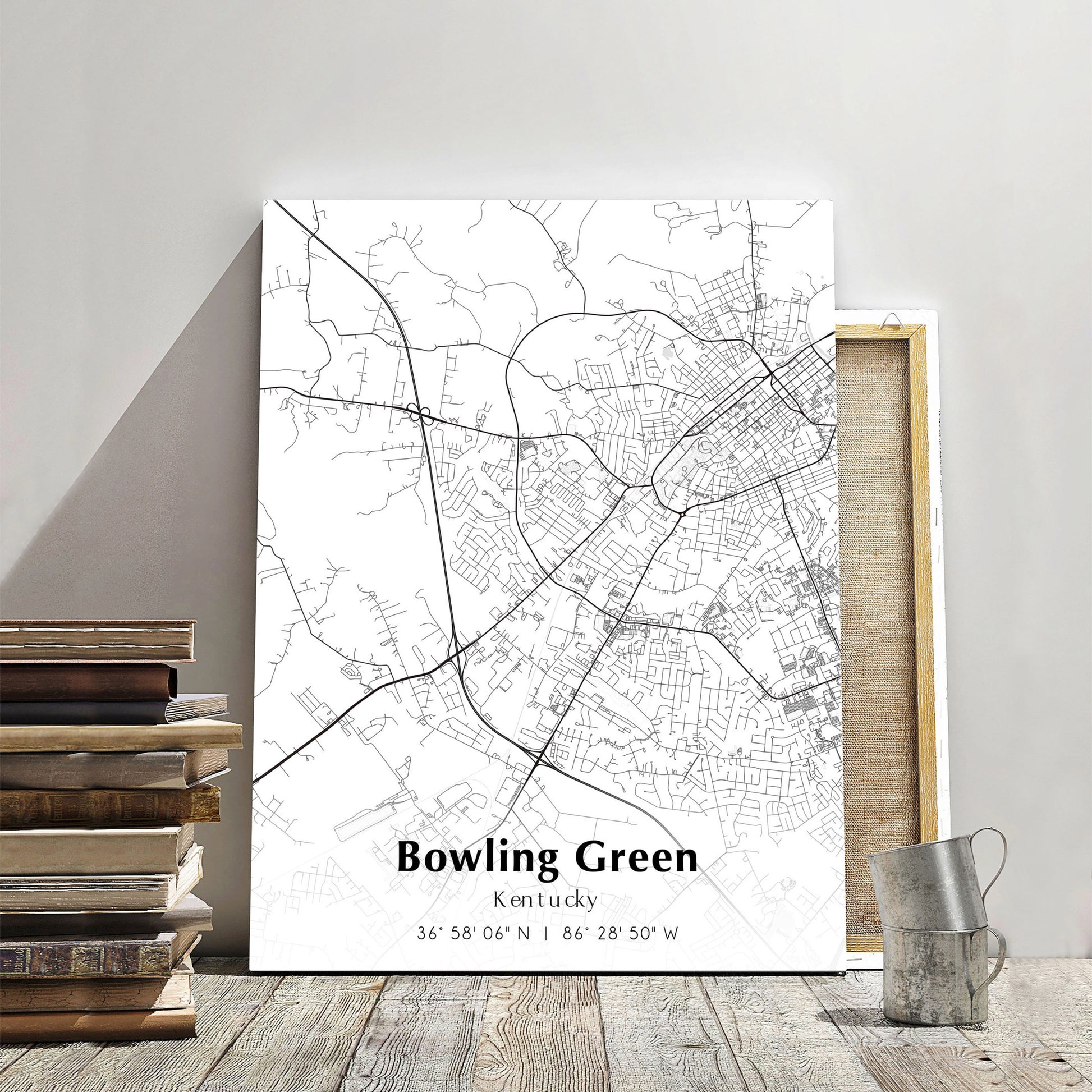 Black and white city map of Bowling Green, Kentucky with street details, framed on a wooden shelf.