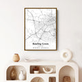 Framed map of Bowling Green, Kentucky hanging on a white wall, showcasing the city's layout in black and white.
