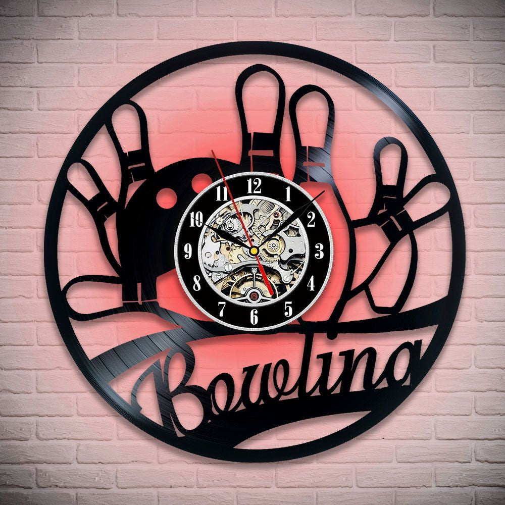 Black vinyl record wall clock with bowling theme, featuring bowling pins and gears inside the clock face.