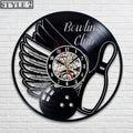 Bowling wall clock with a creative design of bowling pins surrounding the clock face, ideal for decorating a bowling-themed room or alley.