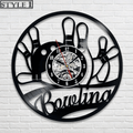 Unique bowling wall clock featuring a vinyl record design and mechanical clock face, surrounded by bowling pins and a ball motif, ideal for bowling fans.