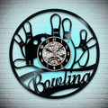 Eye-catching bowling wall clock with winged bowling ball design, combining retro and modern elements to decorate your game space or alley.