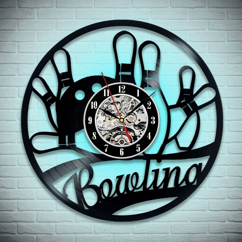 Eye-catching bowling wall clock with winged bowling ball design, combining retro and modern elements to decorate your game space or alley.