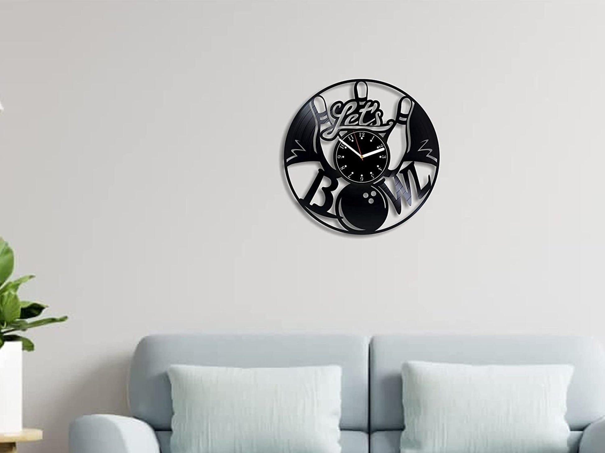 Customizable bowling wall clock featuring a vinyl record with bowling pins and a ball.