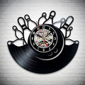 A creative clock made from a vinyl record with bowling pins design. Features mechanical watch details in the center