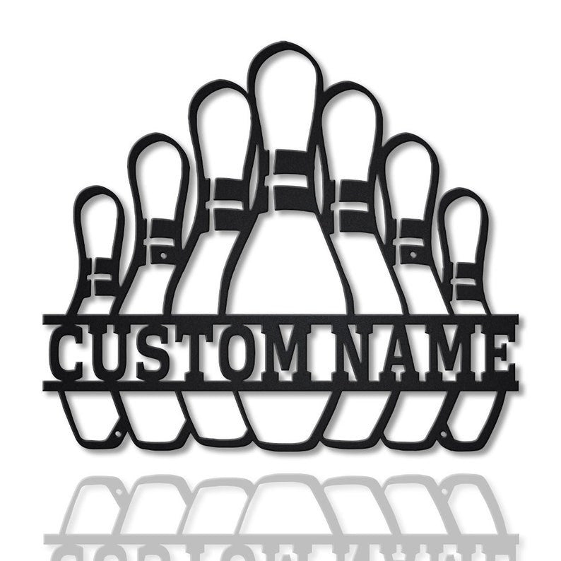 Close-up of black metal bowling pin sign with customizable name section, isolated on white background with reflection.