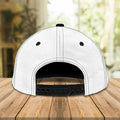 Alt text: “Back view of white and black snapback bowling cap showing adjustable plastic strap”