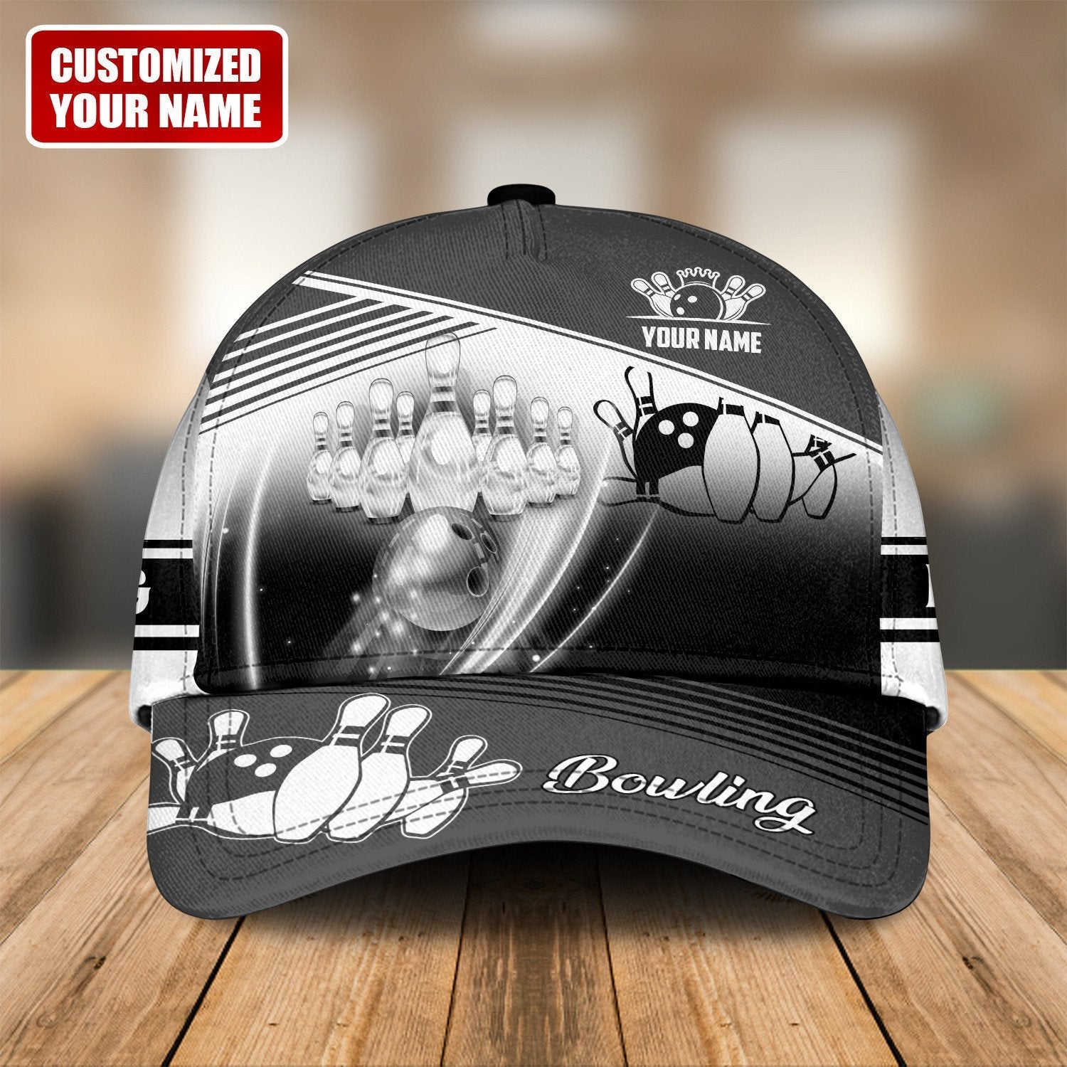 Custom black and white bowling cap with strike scene and bowling ball
