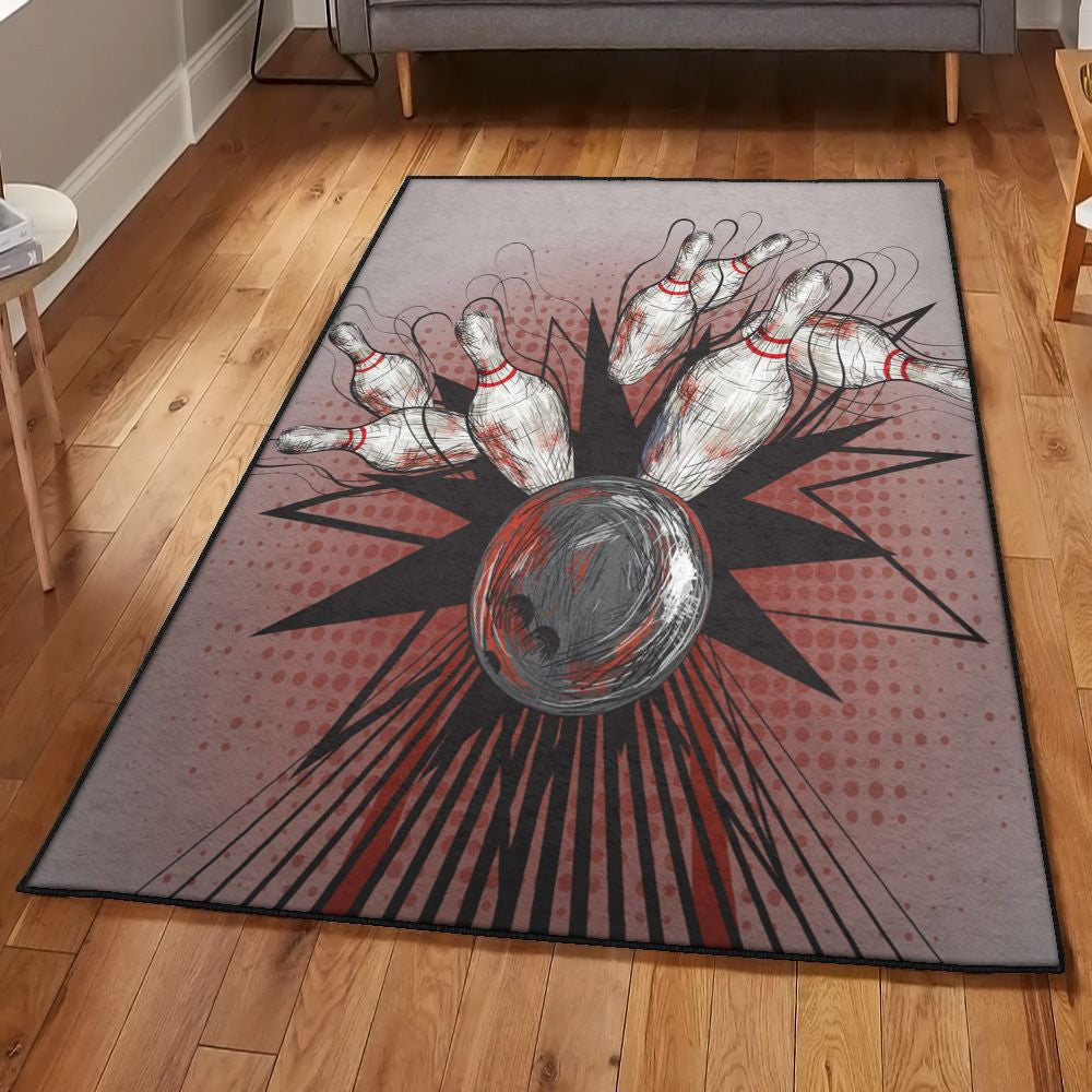 Front view of Strike Zone Bowling Rug featuring a stylized bowling ball striking pins in a comic-style burst pattern on a gray and red background.