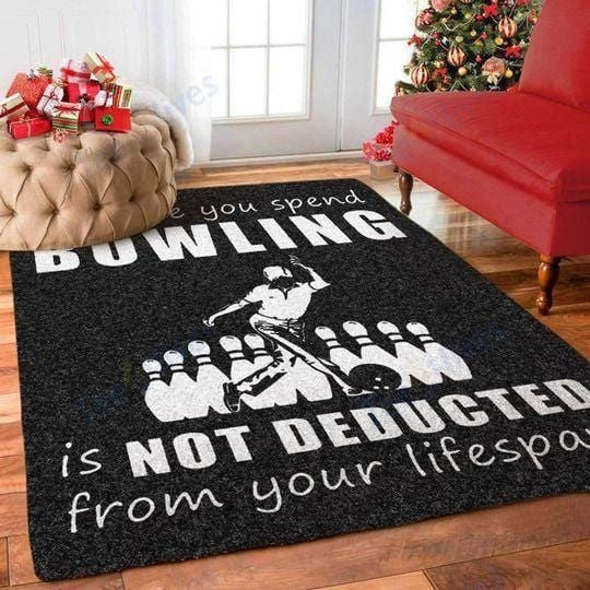 Rug with bowler silhouette and quote saying time spent bowling is not deducted from lifespan